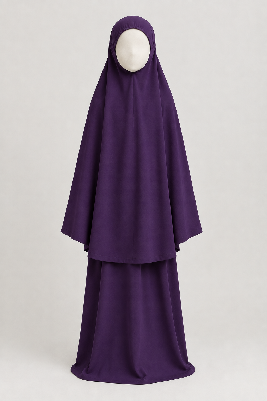 Front view of the girls' prayer outfit in dark purple, on a child-sized faceless mannequin