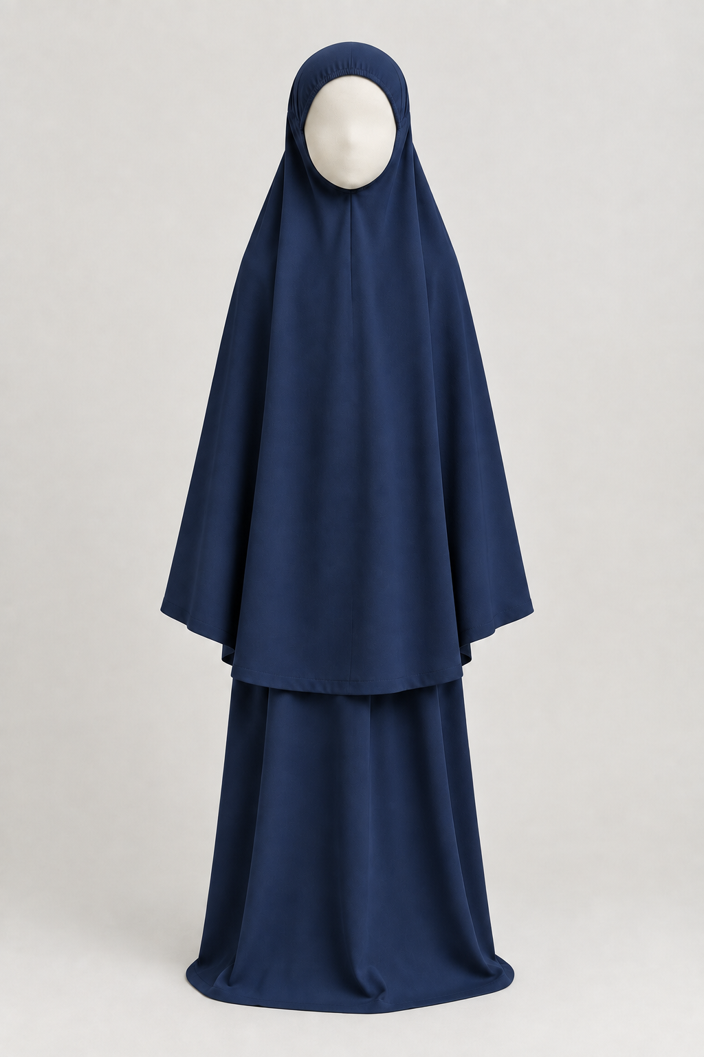Front view of the girls' prayer outfit in navy blue, on a child-sized faceless mannequin