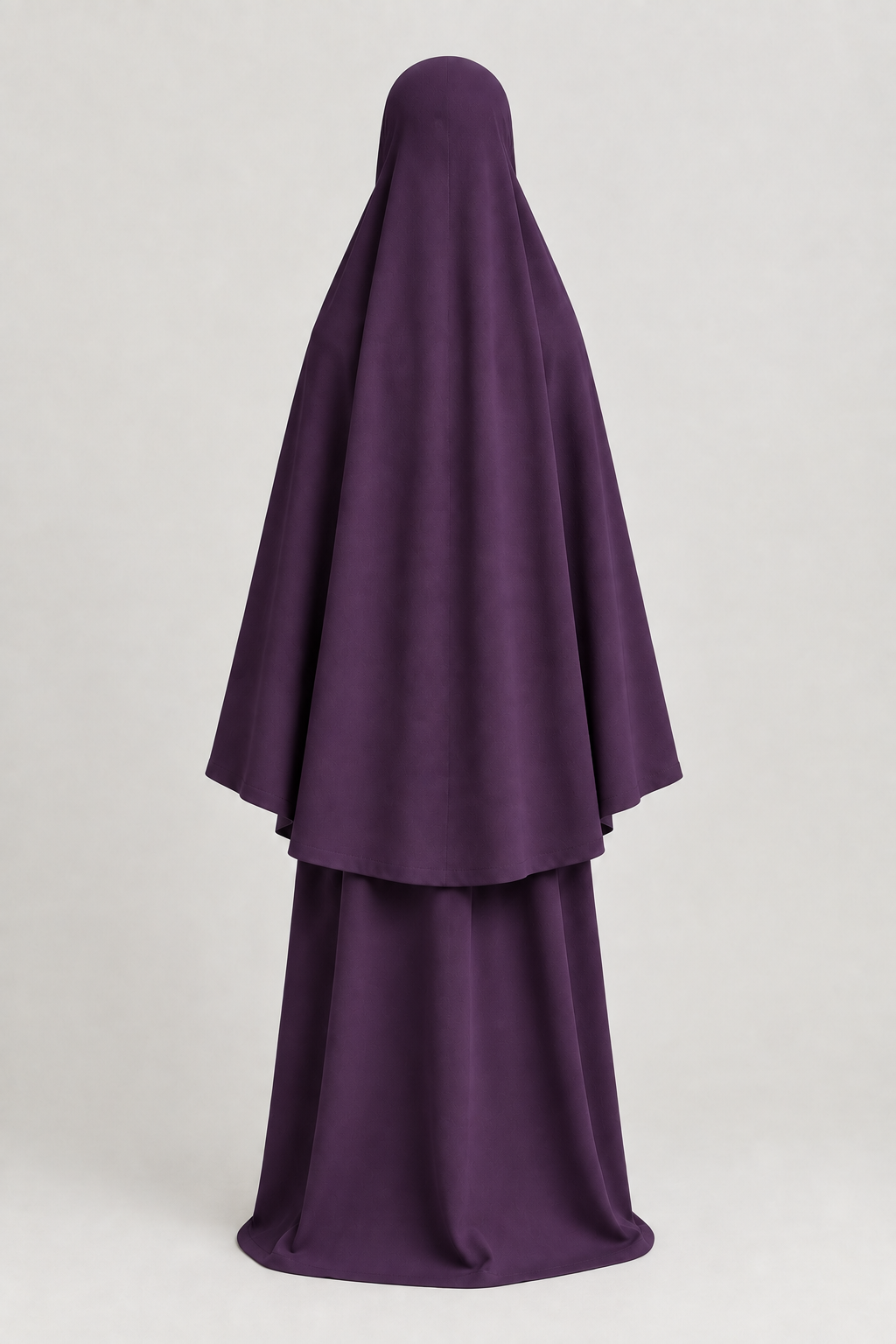 Back view of the girls' prayer outfit in dark purple, with a smooth head covering on a child-sized faceless mannequin