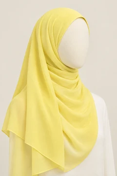 Lemon yellow scarf styled on a mannequin